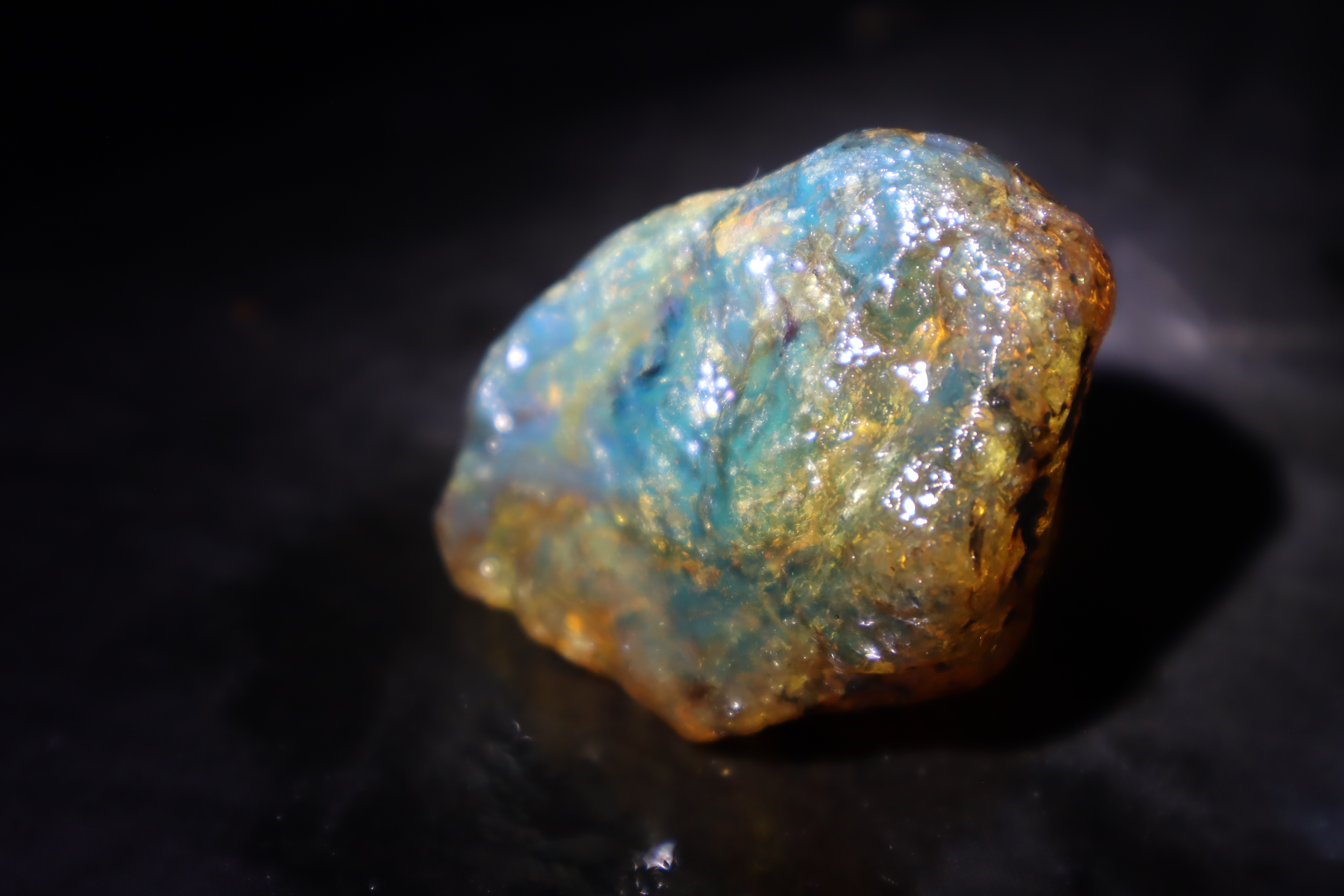Natural blue amber rough stone with blue fluorescence